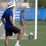 Nate Lie stands in front of a soccer net.