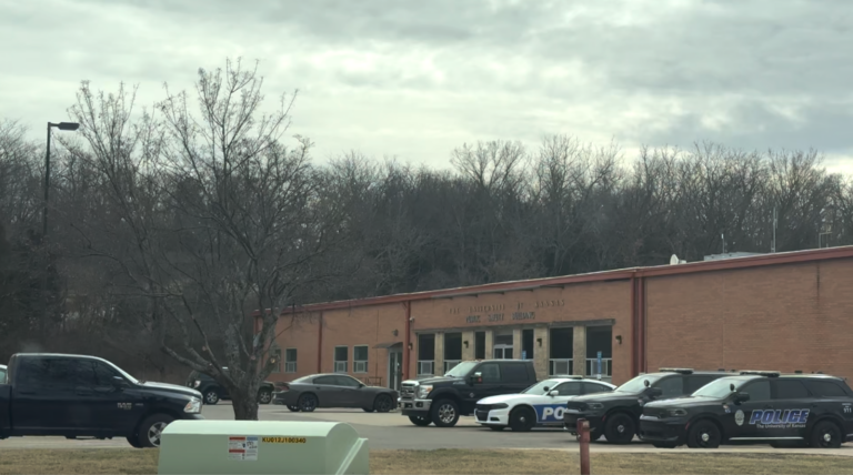 The KU Police Department with cars parked outside