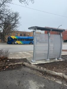 A new bus shelter installation at 8th and Vermont Streets