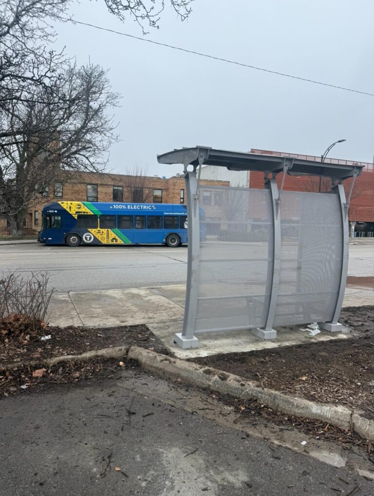 A new bus shelter installation at 8th and Vermont Streets