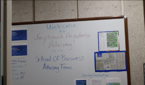 A white board reads "Welcome to Jayhawk Academic Advising"
